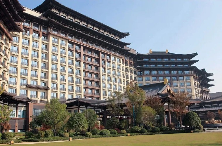 Layered terracotta facade panels in resort hotel architecture